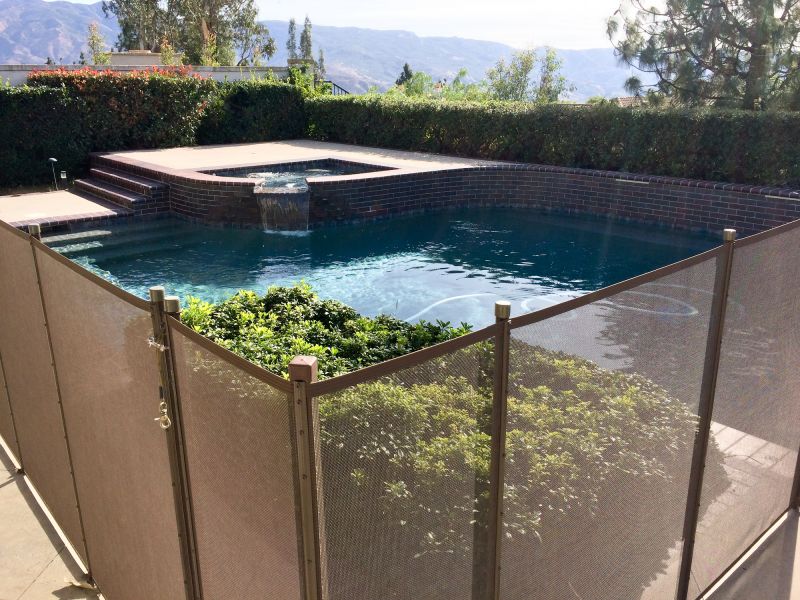 Mesh Fence with Pool in Background